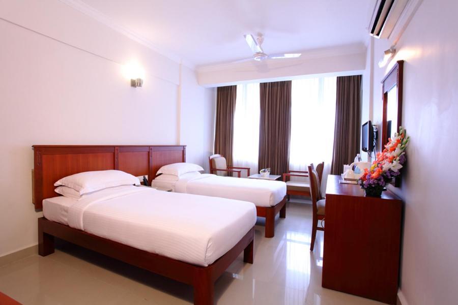 Hotel Pooram International Thrissur Habitación foto
